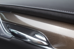 2020-Cadillac-XT6-Premium-Luxury-with-Platinum-Package-Interior-XT6-Drive-004-door-stitching-carbon-fiber-trim-door-handle