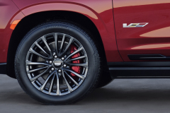 2023-Cadillac-Escalade-V-Press-Photos-Exterior-011-front-wheel-tire-red-brake-caliper-V-Series-logo-badge-on-door