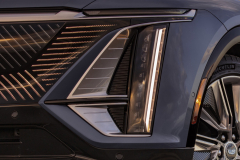 2023-Cadillac-Lyriq-Press-Photos-Media-Drive-Exterior-017-Stationary-front-vertical-headlights-grille-front-wheel-amber-marker-light