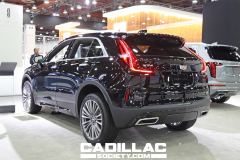 2024-Cadillac-XT4-Premium-Luxury-350T-Stellar-Black-Metallic-GB8-2023-NAIAS-Live-Photos-Exterior-003-rear-three-quarters-tail-light