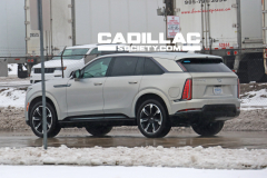 2025-Cadillac-Escalade-IQ-Sport-Flare-Metallic-On-The-Road-Photos-Exterior-007-rear-three-quarters-tail-lights