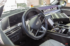 2025-Cadillac-Escalade-V-Prototype-Spy-Shots-No-Camo-May-2024-Interior-003-cockpit-dash-steering-wheel-digital-instrument-panel-gauge-cluster-screen
