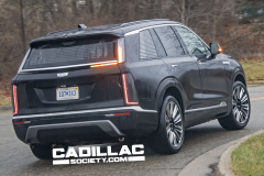 2026-Cadillac-Vistiq-Black-Real-World-Photos-March-2024-Exterior-009-rear-three-quarters-tail-lights-turn-signal