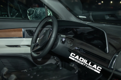 2026-Cadillac-Vistiq-Black-Real-World-Photos-March-2024-Interior-002-cockpit-dash-digital-instrument-panel-gauge-cluster-steering-wheel-door-panel