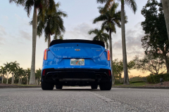 2022-Cadillac-CT4-V-Blackwing-GMA-Garage-Electric-Blue-Exterior-022-rear-low-angle