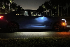 2022-Cadillac-CT4-V-Blackwing-GMA-Garage-Electric-Blue-Exterior-025-side-puddle-light-cabin-lights-at-night