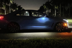 2022-Cadillac-CT4-V-Blackwing-GMA-Garage-Electric-Blue-Exterior-026-side-puddle-light-cabin-lights-at-night