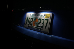 2022-Cadillac-CT4-V-Blackwing-GMA-Garage-Electric-Blue-Exterior-043-License-plate-lights-001-at-night
