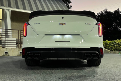2022-Cadillac-CT4-V-Blackwing-Summit-White-Carbon-Fiber-Package-1-and-2-Exterior-010-rear-ground-angle