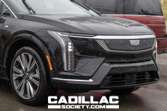 2025-Cadillac-Optiq-Black-Real-World-Photos-March-2024-Exterior-003-front-three-quarters-front-fascia-headlight-grille