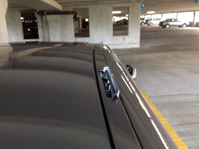 A built-in mounting point for a roof rack on a BMW 5 Series sedan. Cadillac sedan do not have this feature.