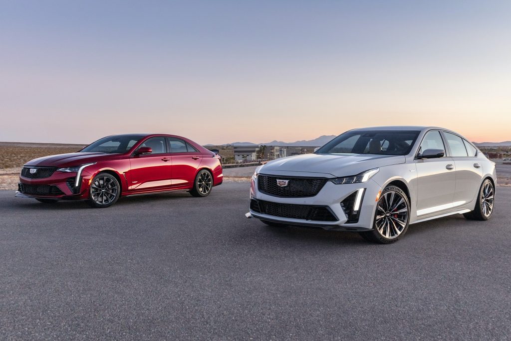 A photo showing the front three quarter vies of the Cadillac CT4-V Blackwing on the left and Cadillac CT5-V Blackwing on the right.