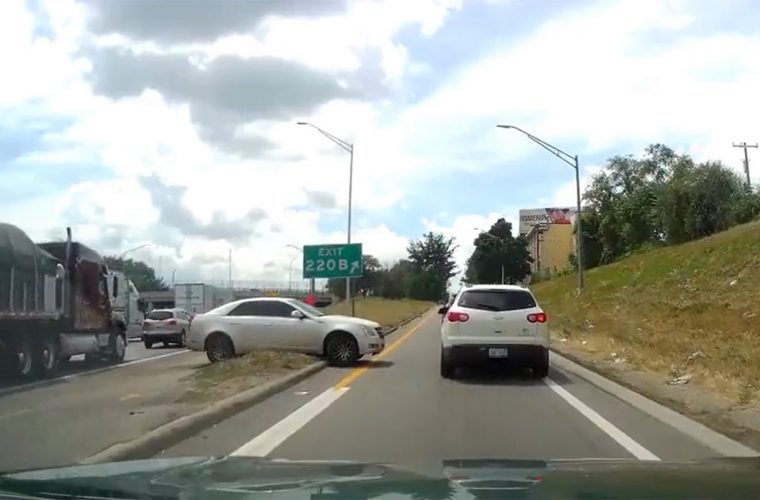 Cadillac CTS Tries To Escape Traffic, Gets Stuck: Video