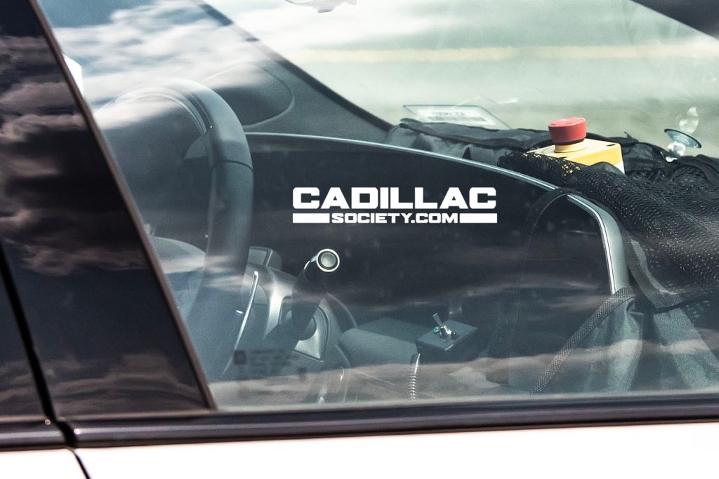 A spy photo showing a partial view of the large, curved display in the refreshed Cadillac CT5.